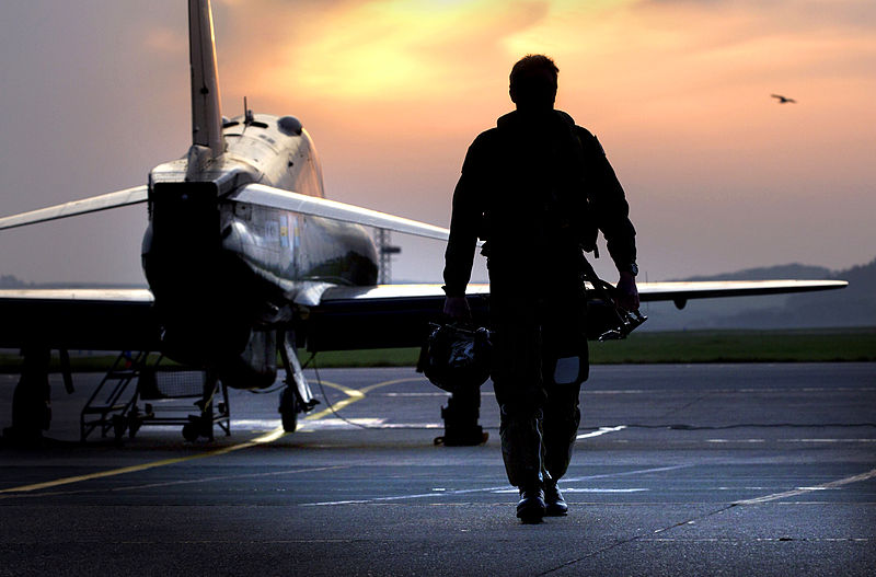 Pilot_Walking_Away_from_Hawk_Aircraft_in_Silhouette